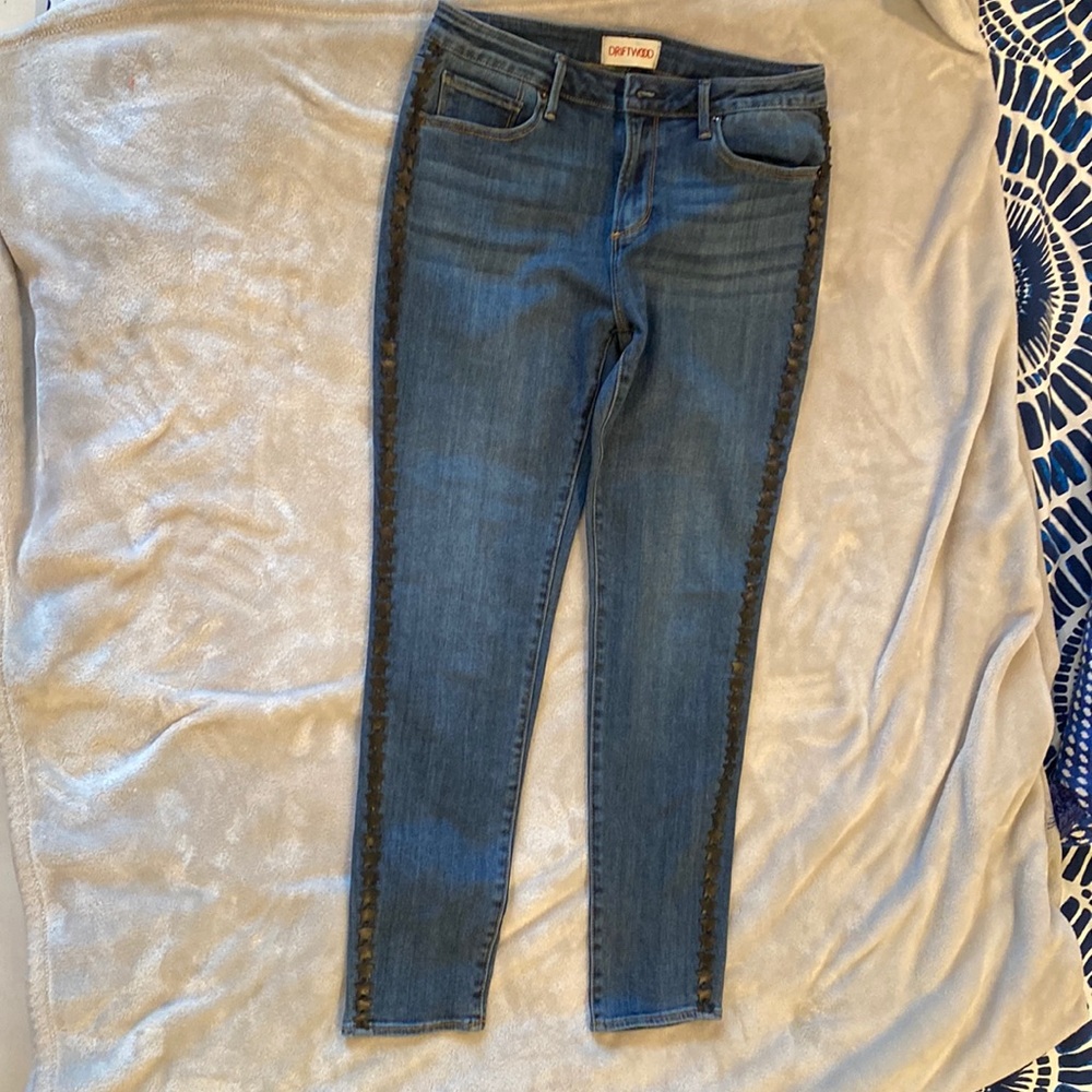 DRIFTWOOD jeans dark wash with star leather look embellishments on outside seams